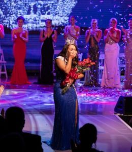 Belle Nicholas stands in center stage as she is crowned Miss New Jersey 2025.