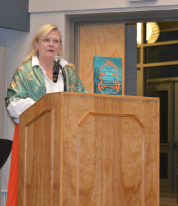 Author Zara Anishanslin speaks at the podium about her book