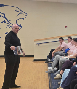 Phil Martelli speaks to student athletes on campus