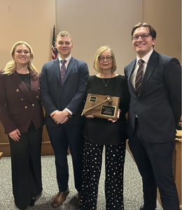 Ethan Adams, Jacob Shobe, and Marisa Miraglia with Associate Professor Leslie Johnson