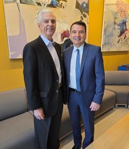 Paul Beideman standing alongside NISS executive director Timothy Renick