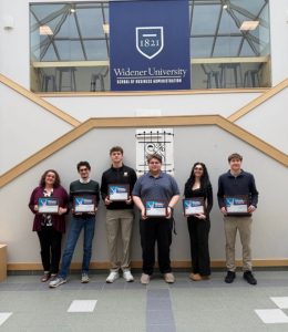Students pose with their certificates 