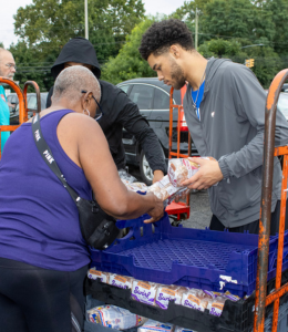 Widener student volunteers distribute food, clothing and school supplies at a back-to-school drive 