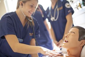Female nursing student hands on in a clinical setting