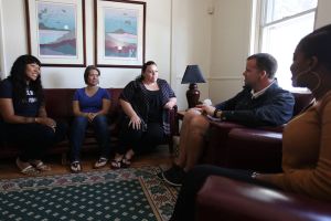 widener university social students discuss in a group setting