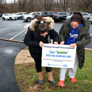 Students place Breathe signs