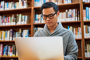 Student taking online class 300x200 Student taking online class