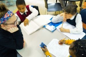 Student volunteers work with children at the Boys and Girls Club of Chester