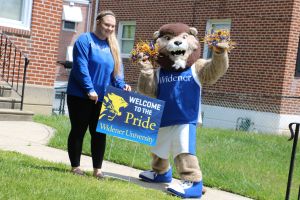 Mascot Chester greets accepted student Brianna Tittermary