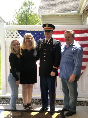 2nd Lt. James Hennelly with his parents and sister