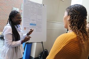 Student Presenting Research Poster