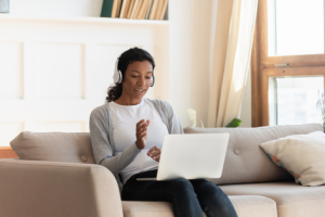 Professional using laptop while at home on couch
