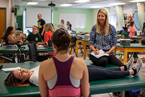 Physical therapy (DPT) student in Chester Community Clinic 300x200 Physical therapy (DPT) student with client and faculty in Chester Community Clinic