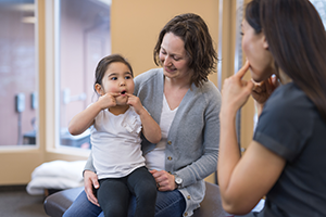 Speech-language pathologist working with child