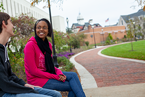 Two students talking outside Wolfgram Library