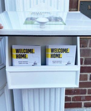 Stacks of pamphlets in a covered outdoor shelf