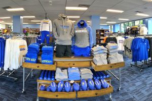 Interior of Widener bookstore with Widener shirts, shorts, and other paraphernalia on racks and tables