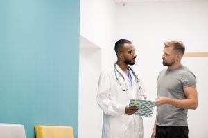 Patient discussing health concern with a physician assistant