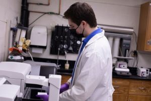 Michael Oravic runs a lab test in the NanoBio Lab.