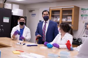 Professor Patil leads a discussion with student-researchers