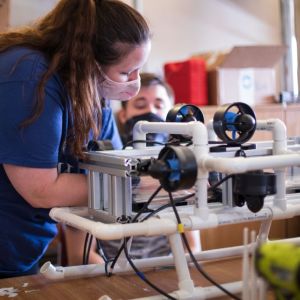 A female and male student work on a project hands-on