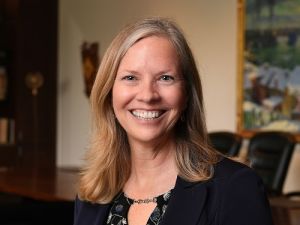President Stacey Robertson head shot in board room