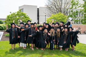 Speech language pathology graduates celebrate together at commencement.