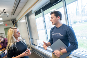Widener University Delaware Law School student speaks with faculty mentor.