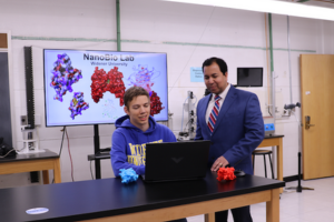 A chemical engineering student being mentored by a faculty member