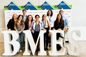 Widener engineering students and faculty in front of a BMES sign