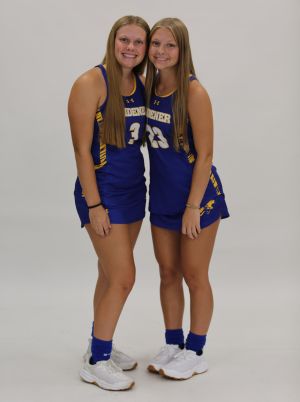 Sisters Krista and Karly Bervinchak, wearing Widener field hockey uniforms.