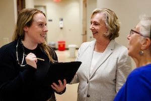 two widener school of nursing graduate professors mentor nursing masters student holding tablet in health care office