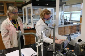 Professor and student test detergents in lab