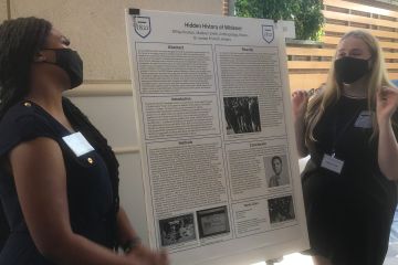 Two students present their research at the annual Summer Undergraduate Research and Creative Activities (SURCA) Symposium.