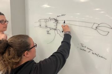 Occupational therapy students sketch out a prototype design in The Maker's Lab.