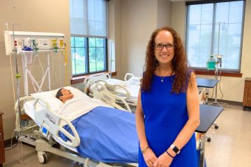 Dean Audrey Snyder poses in a nursing simulation lab.