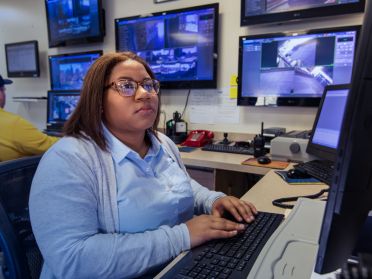 Samirah Thompson watches security cameras