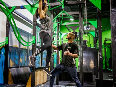 Cajua Robinson works with a client at iCore Fitness