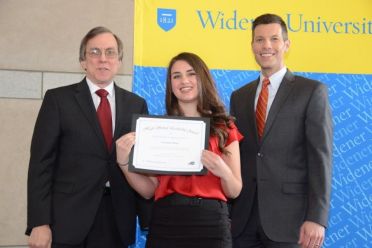 Annamarie Burns holds leadership certificate with two other people
