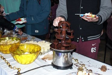 Student standing at a chocolate fountain