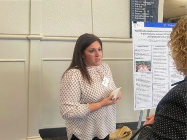 Lauren Thomas presents her research poster.
