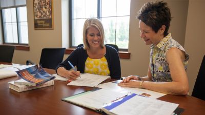 Pictured is a student working towards their doctorate degree in nursing with a faculty mentor. Whether you are earning your nursing Phd or DNP, you will be supported by Widener's staff and faculty as you enter one of our nursing doctorate programs. 