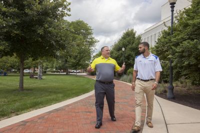 staff and student walking 