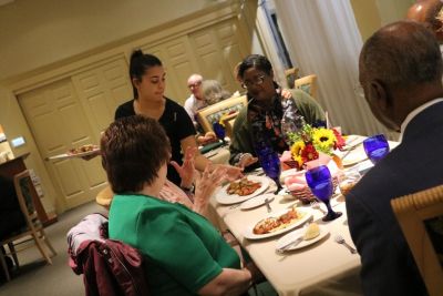 Hospitality management student serves dinner for fundraiser