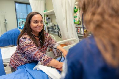 Nursing professor with a nursing undergraduate student in the simulation lab