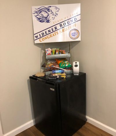 Mini fridge, snacks, and Widener sign