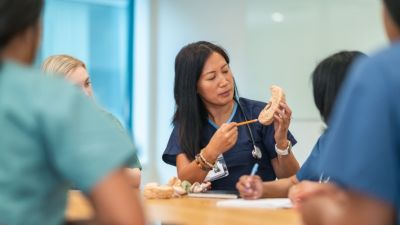 Health care educator teaching in a hospital setting