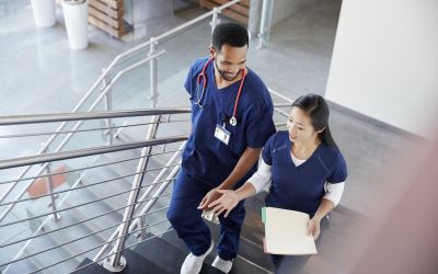 BSN Nurses Walking in Medical Center Wearing Nursing Uniforms