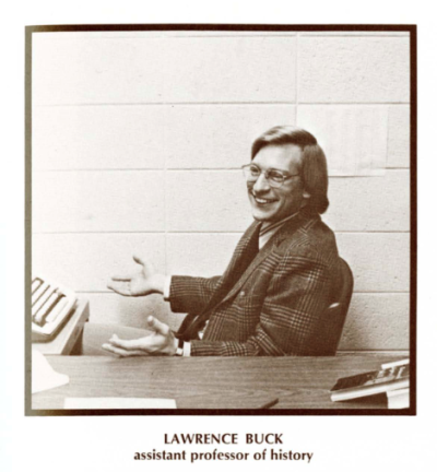 Sepia photo of Larry Buck at a desk in 1973