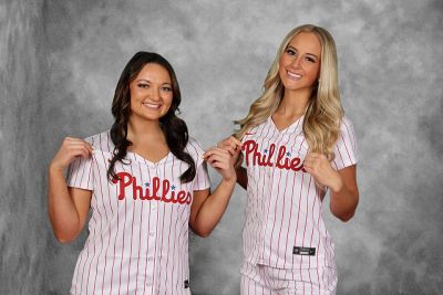 Ball girls MacKenzie Lewis and Sammy McCarthy pose for a photo in Phillies jerseys